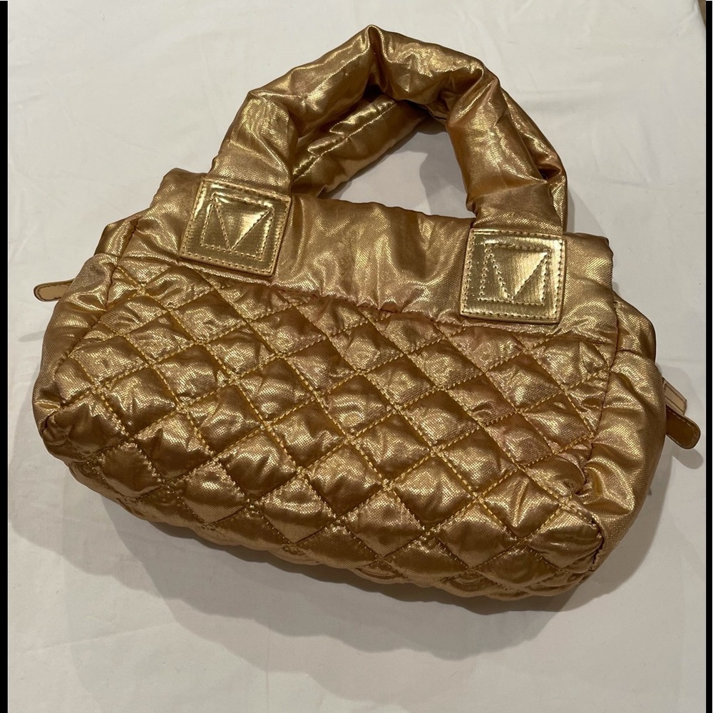 Super rad gold quilted bag. Excellent condition.